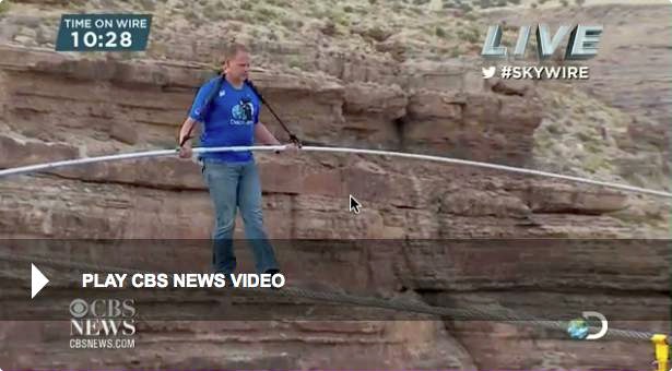 Photo of Nik Wallenda, walking across a gorge near the Grand Canyon